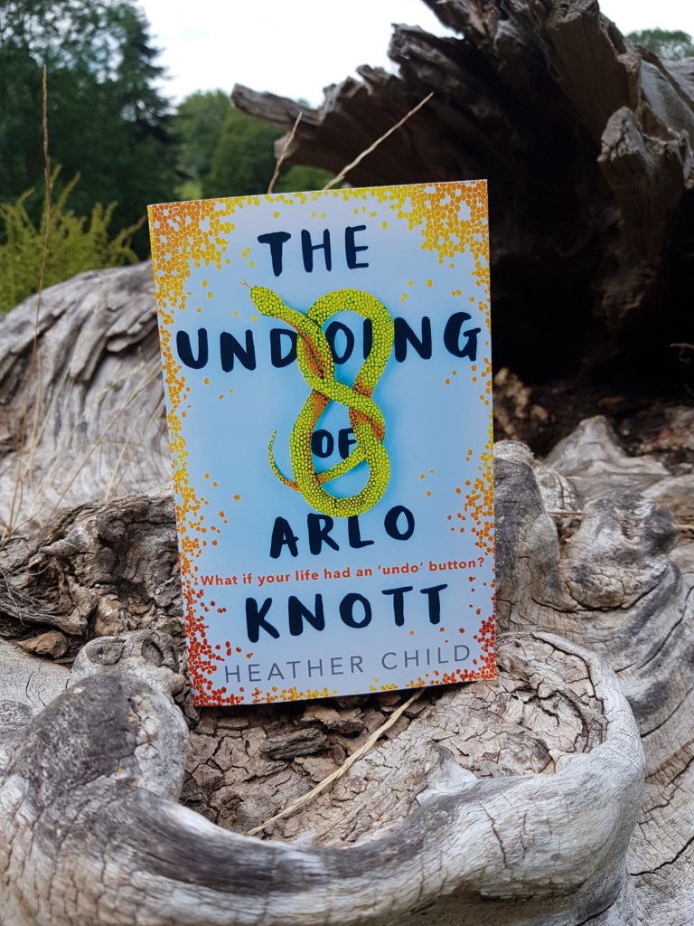 The Undoing of Arlo Knott on a log